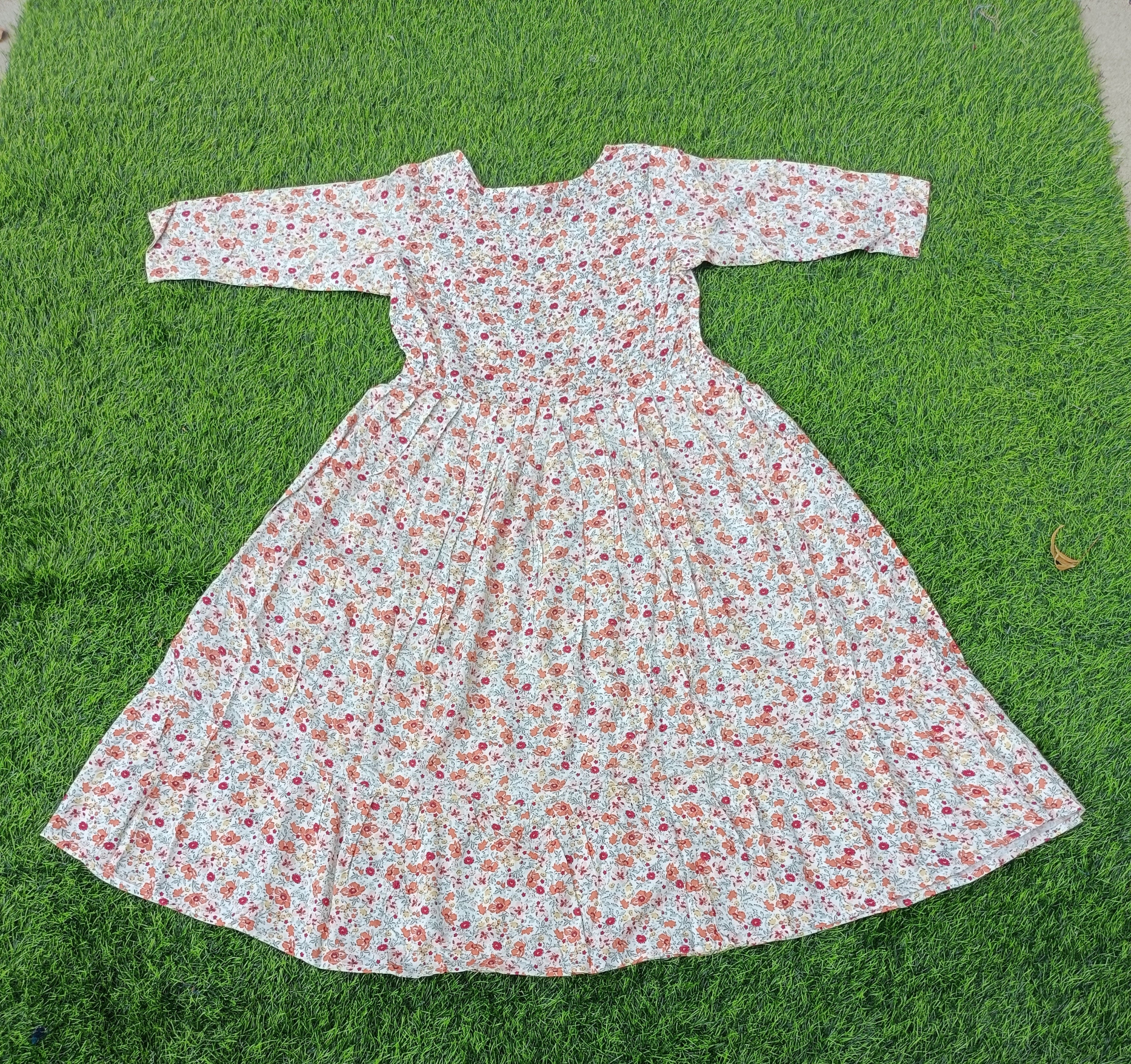 Women'sOff-White with Orange and Pink Floral Print Flared Umbrella model kurti with Elbow Sleeves
