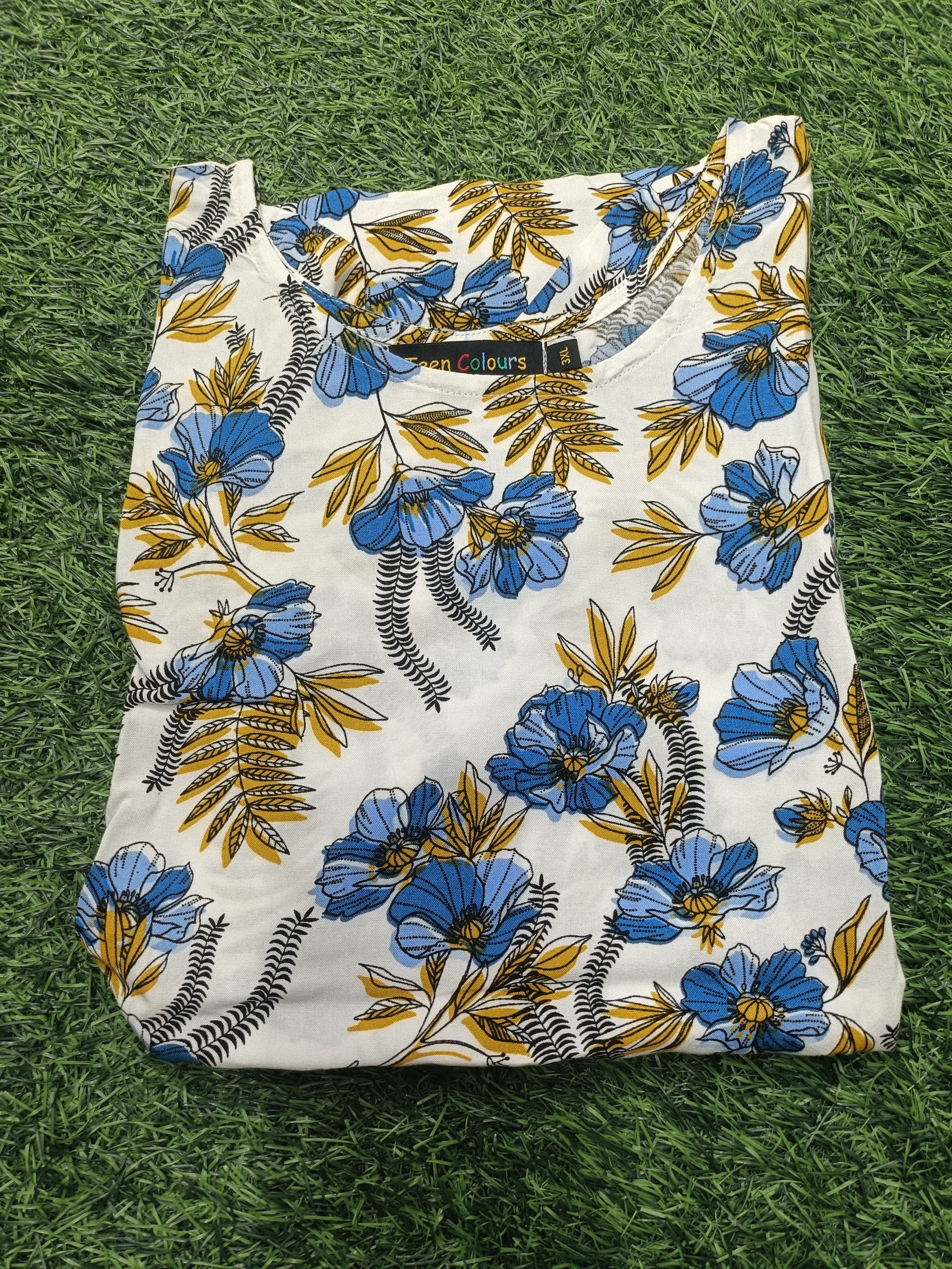 Womens White color rayon Kurti - Blue and Mustard Floral Print, Round Neck, Elbow Sleeves, Straight Cut with Pocket