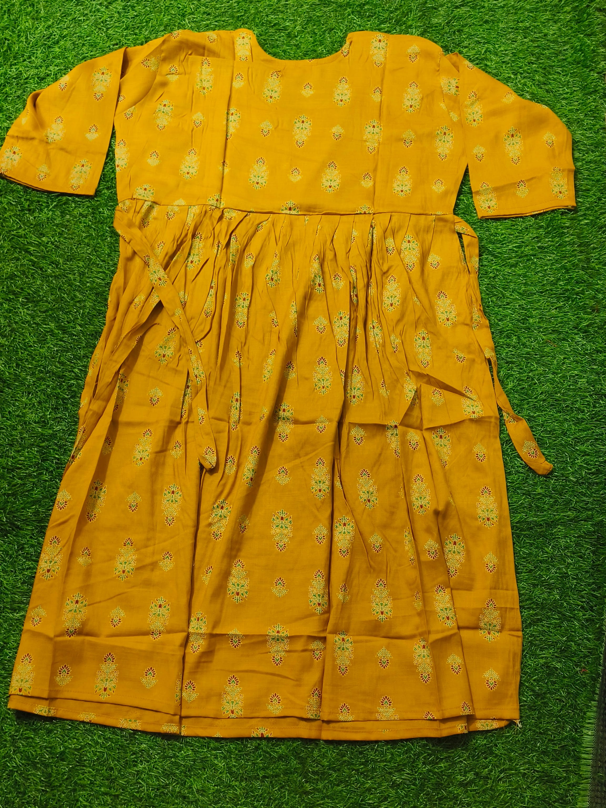 Elegant Mustard yellow Printed Single Piece Kurti with Front Buttons and Waist Tie